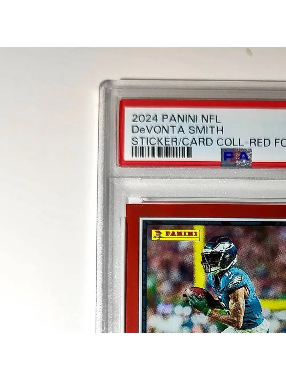 DeVonta Smith 2024 Panini Sticker Collection 048/299 #44 Red Foil PSA 9 Mint